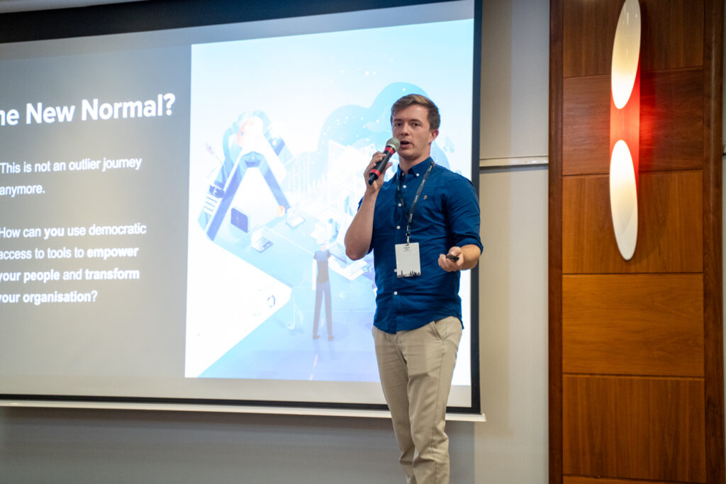 A speaker presenting at a previous ConfX summit