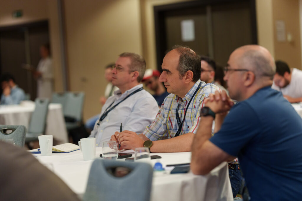 Delegates listening during a session