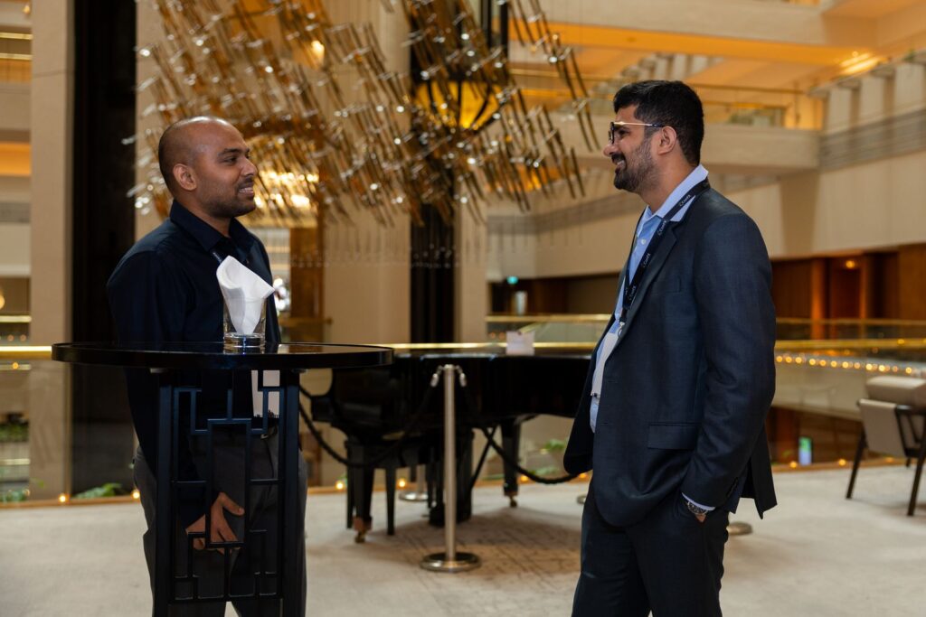 Delegates talking in the venue atrium