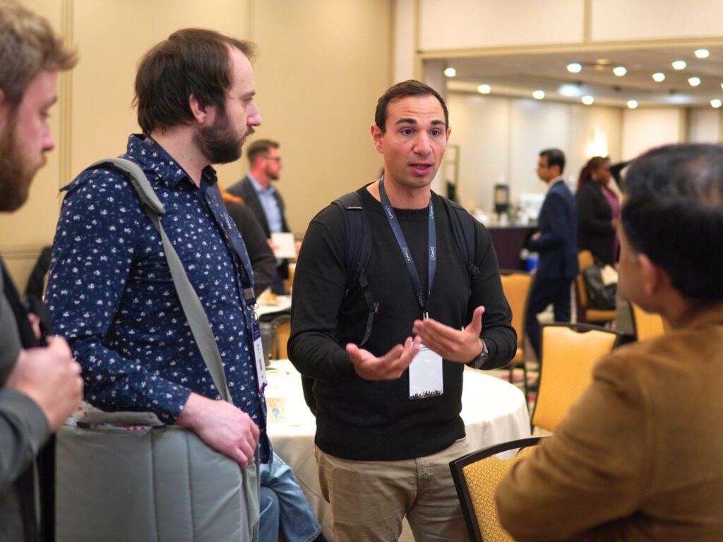 A group of delegates talking together